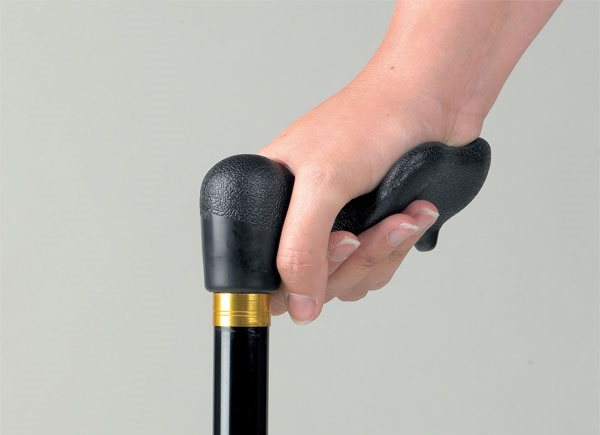 Contoured hand grip on walking stick