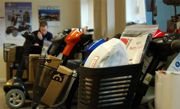 Haven Mobility staff member using telephone in showroom